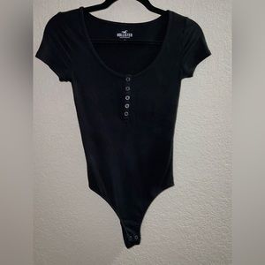 Solid black bodysuit